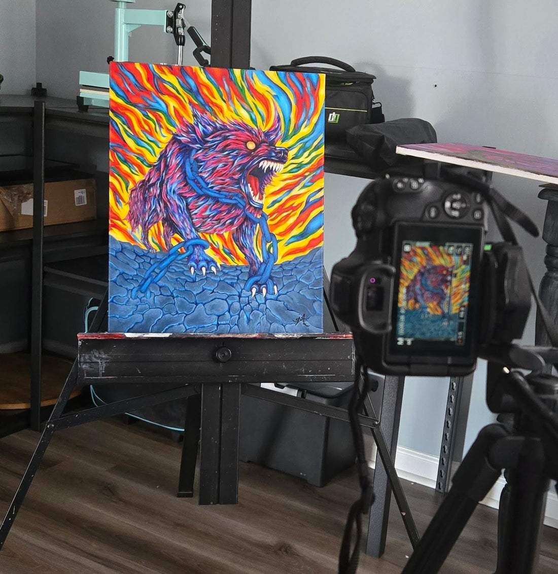 Vibrant, surrealist painting of Fenris Wolf, a snarling red and blue wolf with glowing eyes, chained against a backdrop of swirling red, orange, yellow, green and blue.